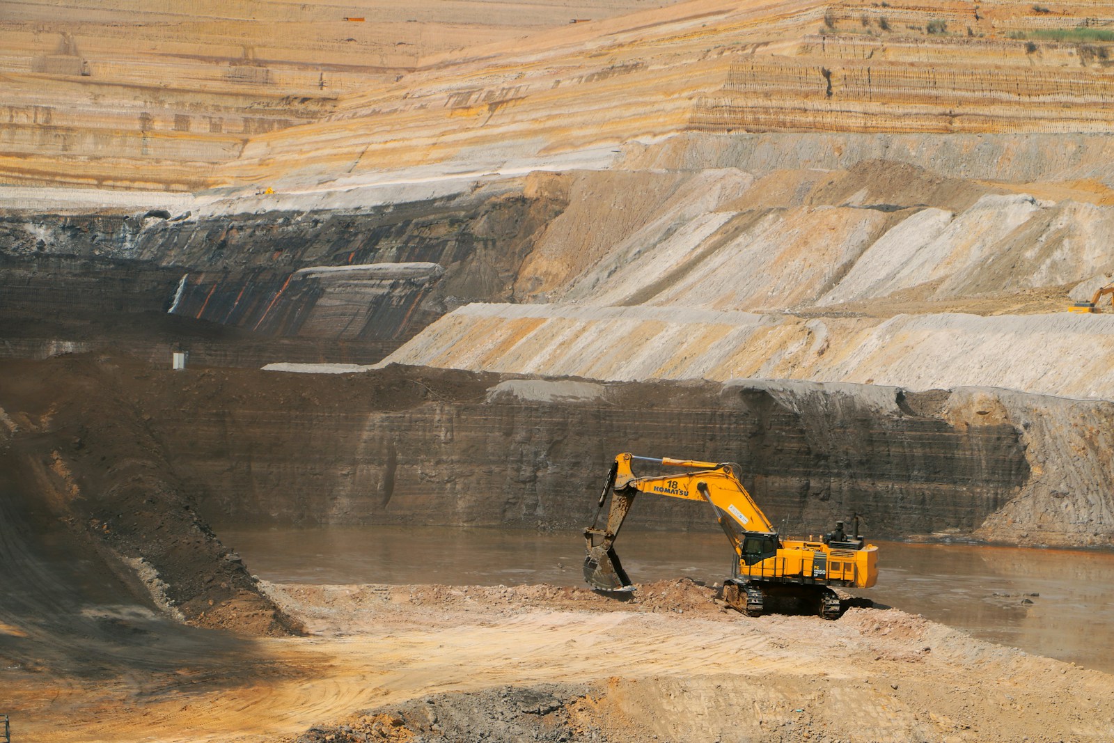 Illustrative open-pit mine with an excavator
